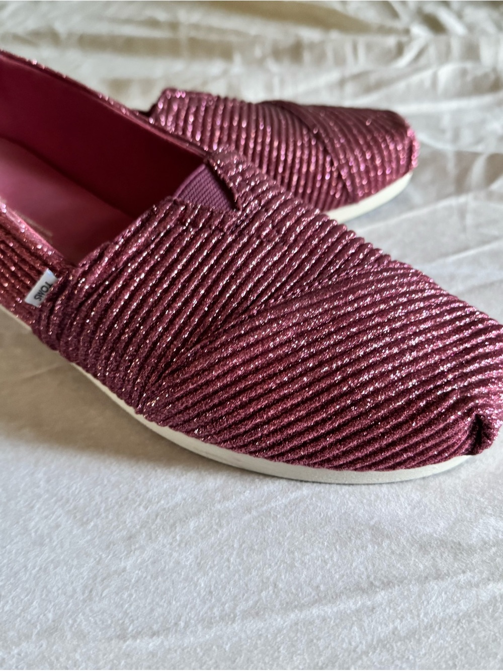TOMS Glitter Ribbed Slip-Ons in Metallic Raspberry Pink